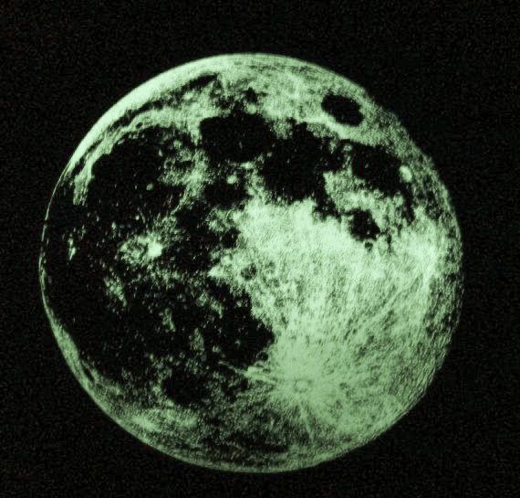 an image of the moon taken from space in black and green light, with dark background