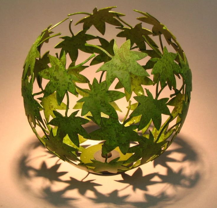 an image of a paper ball with leaves on it and the word interest above it