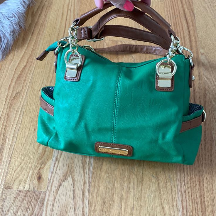 Brand New, Never Used Before, Great Quality, Has Multiple Compartments, Very Convenient, Attachable And Detachable Handles Green Satchel With Gold-tone Hardware, Green Shoulder Satchel With Gold-tone Hardware, Green Shoulder Bag With Gold-tone Hardware And Double Handle, Green Bags With Adjustable Strap, Green Travel Bags With Metal Hardware, Green Bag With Detachable Strap, Green Rectangular Bag With Metal Hardware, Green Shoulder Bag With Adjustable Strap, Everyday Green Hobo Bag With Gold-tone Hardware