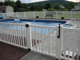 an above ground pool surrounded by white fences