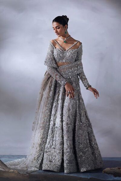 Grey Lehenga Choli Bridal Wedding Dress is a dazzling work of art decorated with hand-created embellishments. Extravagant plans and silver work give an ideal completing focus on this Marriage Lehenga Choli, exemplifying magnificence and beauty.
For more details contact us on our WhatsApp 
+1 (732) 351-5426
Visit our website 
www.nameerabridal.com
#bridaldressonline #bridaloutfit #usabridalgown #usabridaldress #onlinebridaldress #pakistaniwedding   #pakistaniweddingdress #latestbridallehnga #brid Bridal Wear Pakistani, Designer Lehanga, Pakistani Bridal Dresses Online, Net Maxi, Hanging Tassels, Reception Bridal Dress, Pakistani Clothes Online, Printed Organza, Indian Wedding Outfit