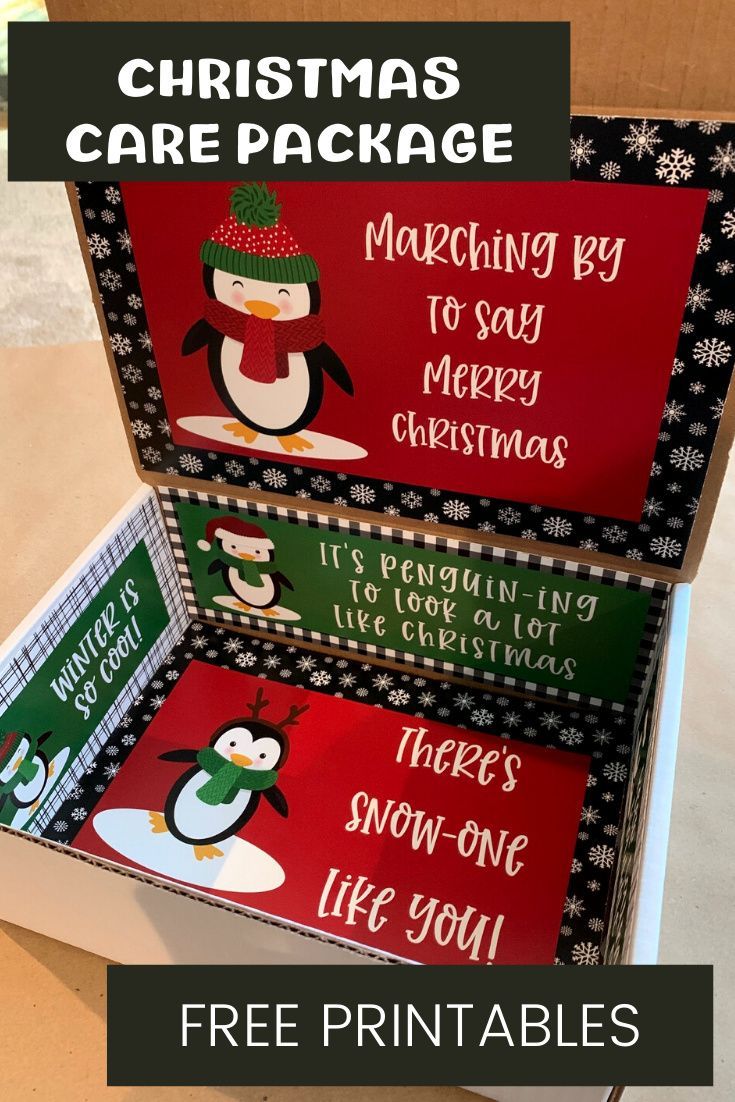 two boxes with christmas cards in them sitting on top of a table