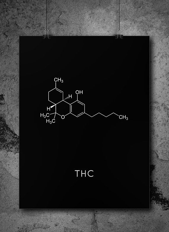 the chemical formula for thc is shown on a black square poster hanging on a concrete wall