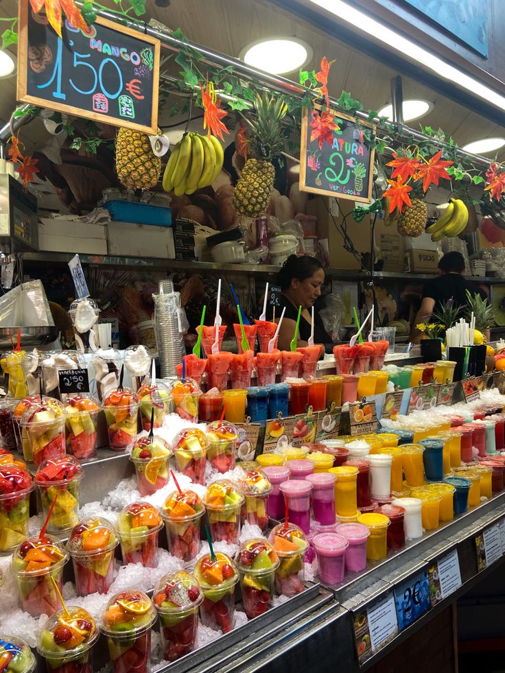 many different types of drinks on display in a store