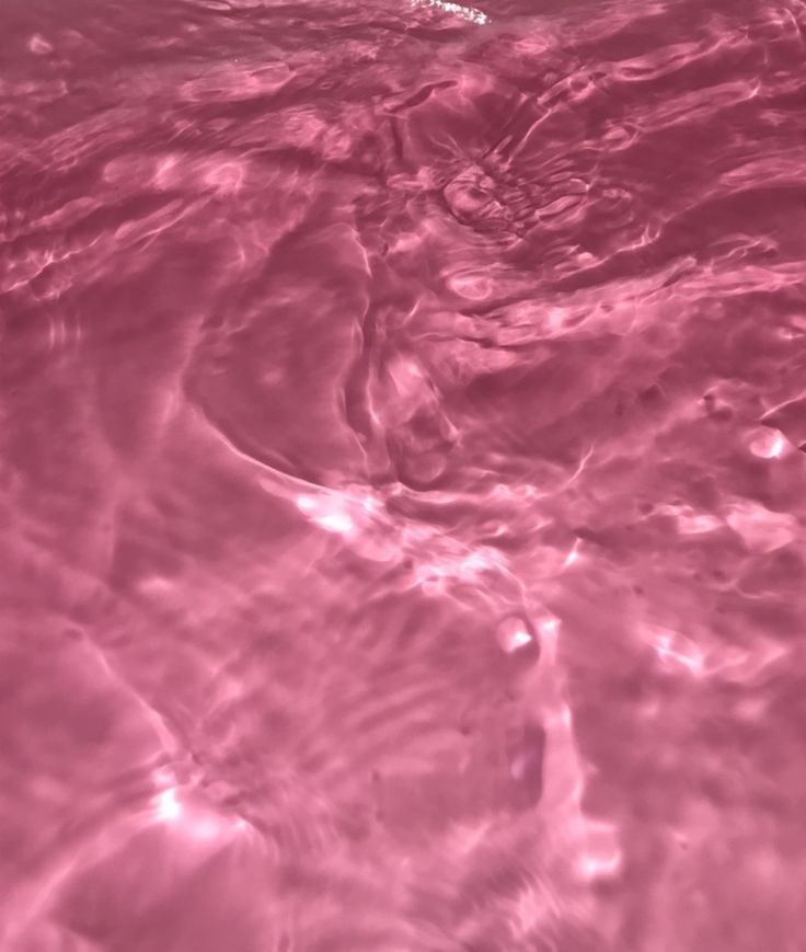 the water is pink and clear with little ripples