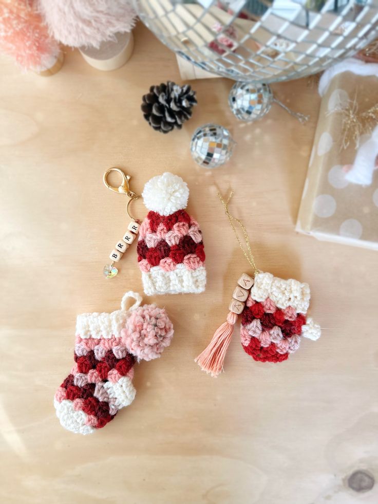 crocheted christmas stocking ornaments on a table