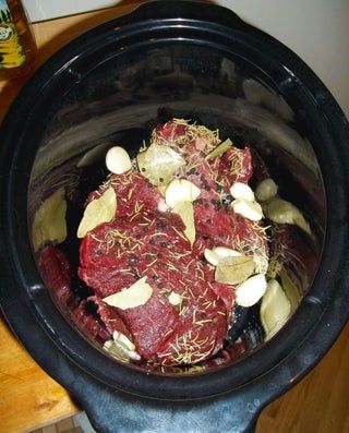 the meat is cooked and ready to be put in the crock pot for cooking