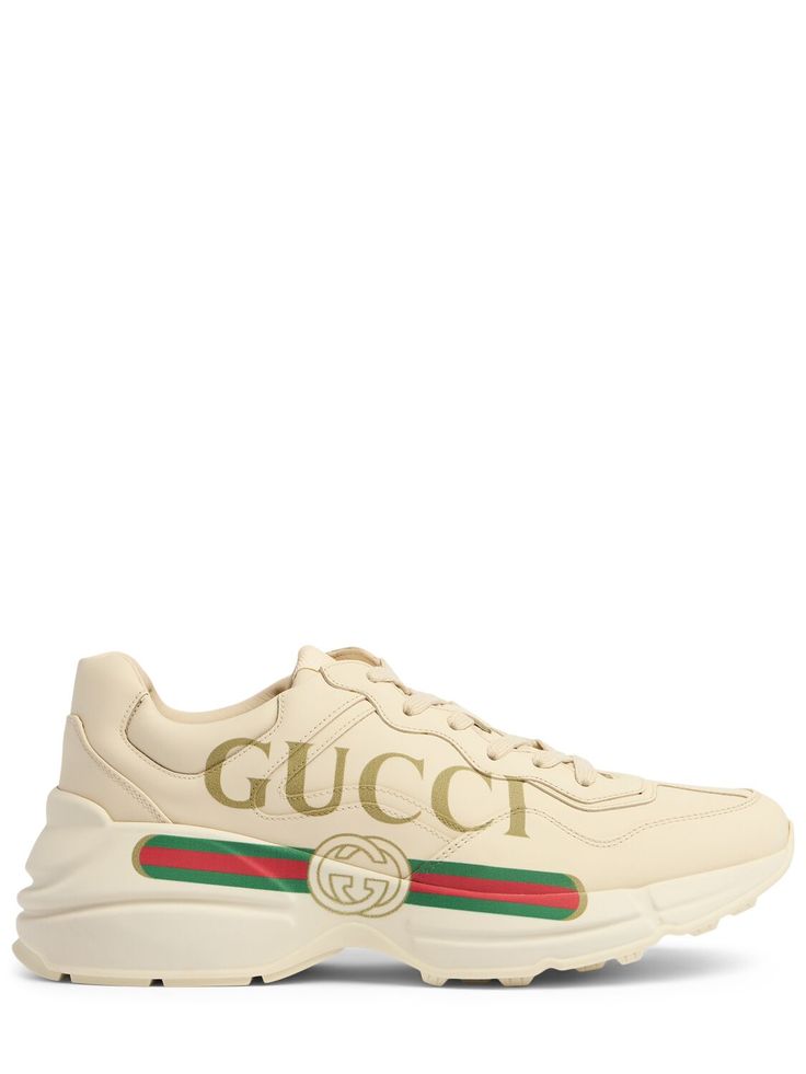 50mm Rubber sole. Leather upper. Front lace-up closure. Inspired by prints from the 1980s. Printed side panel. Logo detail Gucci Womenswear, Tenis Gucci, Gucci Shoes Sneakers, Gucci Designer, Gucci Sneakers, Gucci Eyewear, Buy Gucci, Gucci Fashion, Leather Trainers