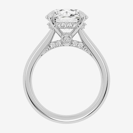 a diamond engagement ring on a white background