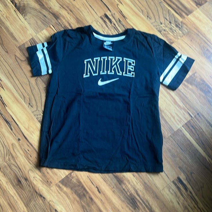 Nike Tshirt Longer Sleeve Length Never Worn Nike Black T-shirt For Spring, Black Tops For College In Spring, Black Spring Tops For College, Nike Short Sleeve Tops For College, Trendy Nike T-shirt With Letter Print, Nike Graphic Tee With Text Print, Trendy Nike Top With Letter Print, Nike Crew Neck Tops For College, Trendy Nike Short Sleeve T-shirt