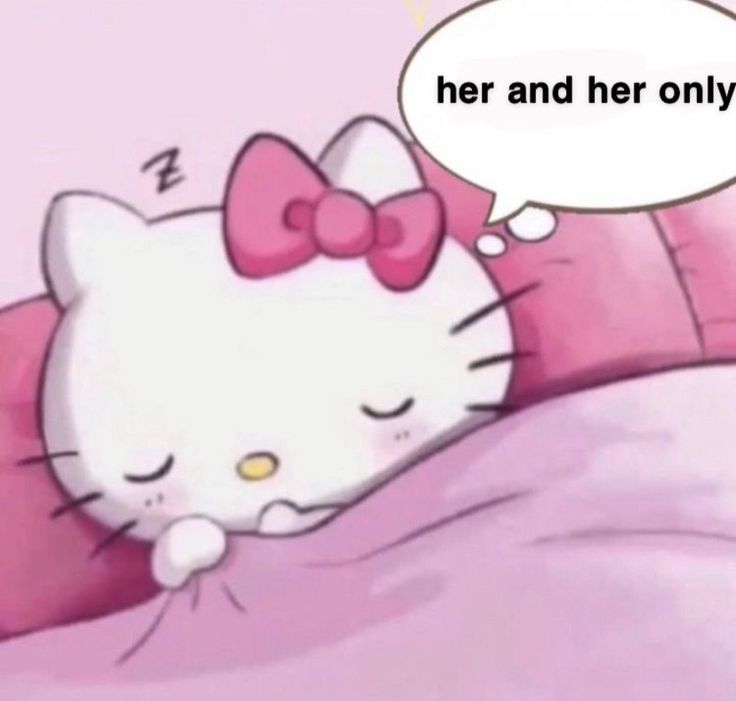 a hello kitty sleeping on top of a pink pillow with a speech bubble above it