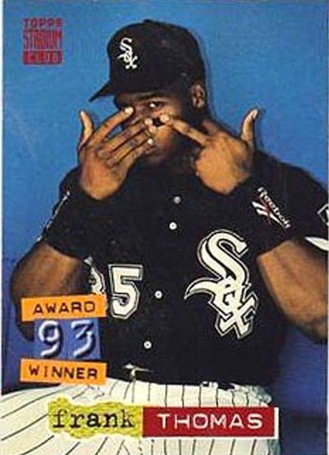 a baseball player holding his hands to his mouth