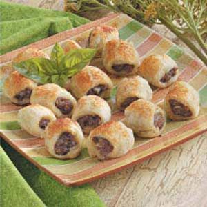 small pastries are arranged on a plate with green napkins and flowers in the background