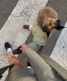 two people sitting on the ground with their feet in each other's laps