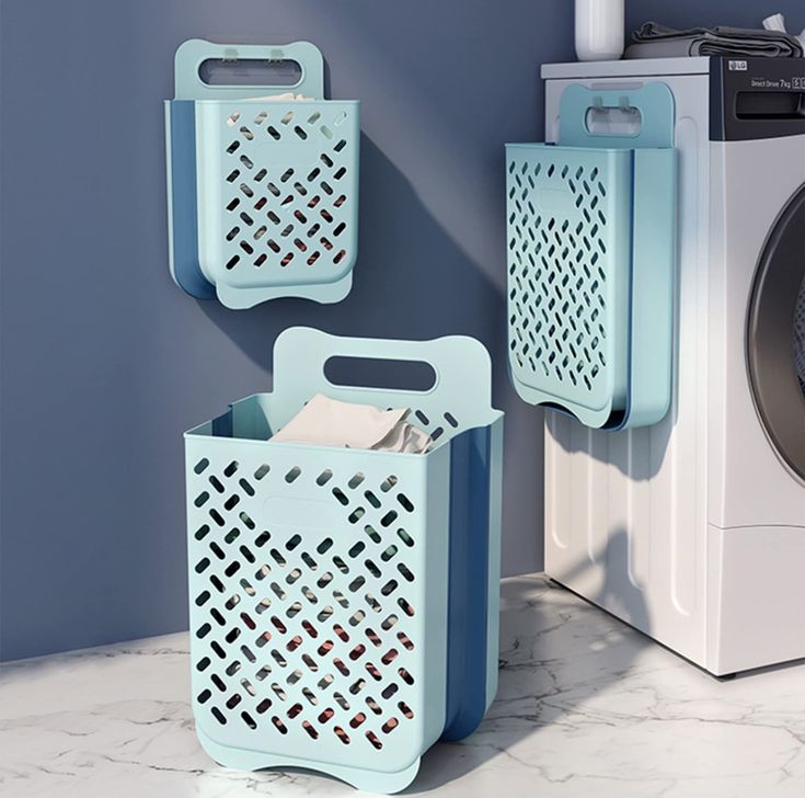 two blue baskets next to a washer and dryer