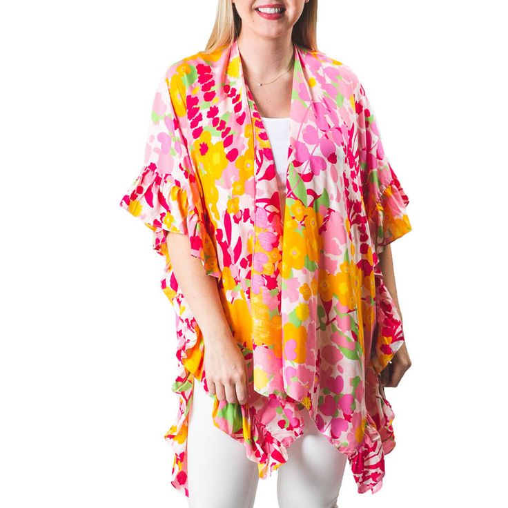 The one size Ruffle Kimono is a great addition to your swim and resort wear. Perfect length for great coverage, with ruffle trim detail along sides and fun prints. Fun sea life or bright florals are great for the pool, beach or over your favorite white jeans. Details & Care One Size 100% Viscose Hand wash. Hang dry. Imported White Spring Swimming Cover-up, White Spring Cover-up For Swimming, White Floral Print Swimwear For Beach Cover-up, Playful Ruffled Swimwear For Summer, Playful Swimwear With Upf 50+ For Spring, Playful Swimwear With Upf 50+, Playful Upf 50+ Swimwear For Spring, Summer Floral Print Cover-up For Poolside, Springtime Beachy Swim Cover-up