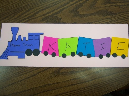 a paper train with the name kate written in blue and pink on it's side