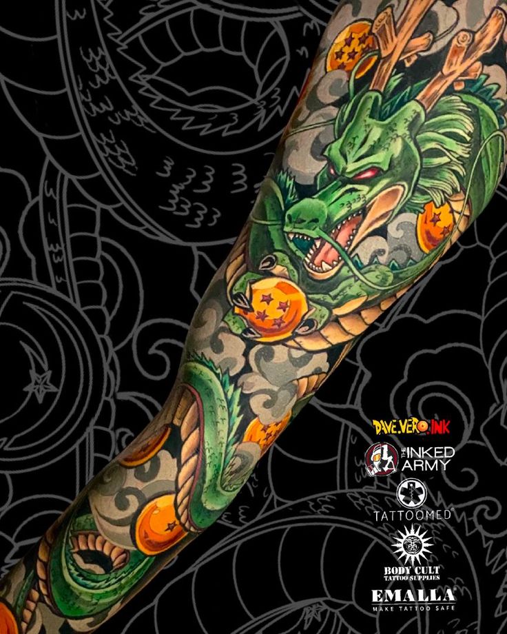 a dragon tattoo on the arm with oranges and other things in it's body