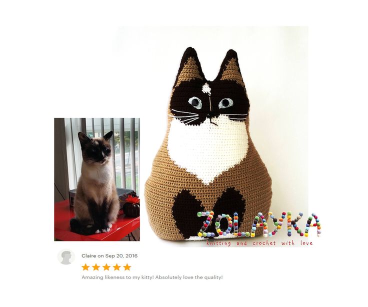 a crocheted cat sitting next to a stuffed animal