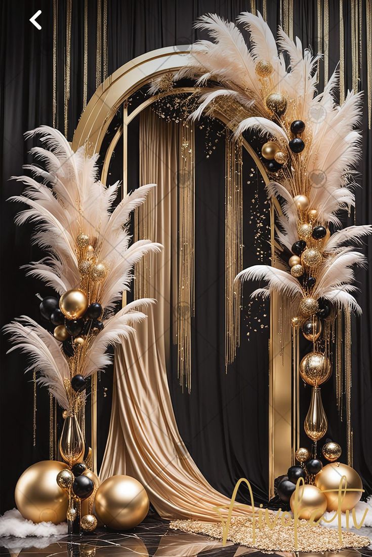 a black and gold party decoration with white feathers, balloons and streamers in front of a backdrop