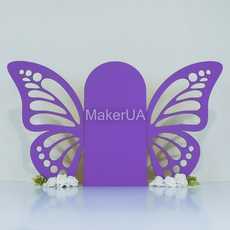 a purple butterfly with the word makerua on it's back and white flowers in front