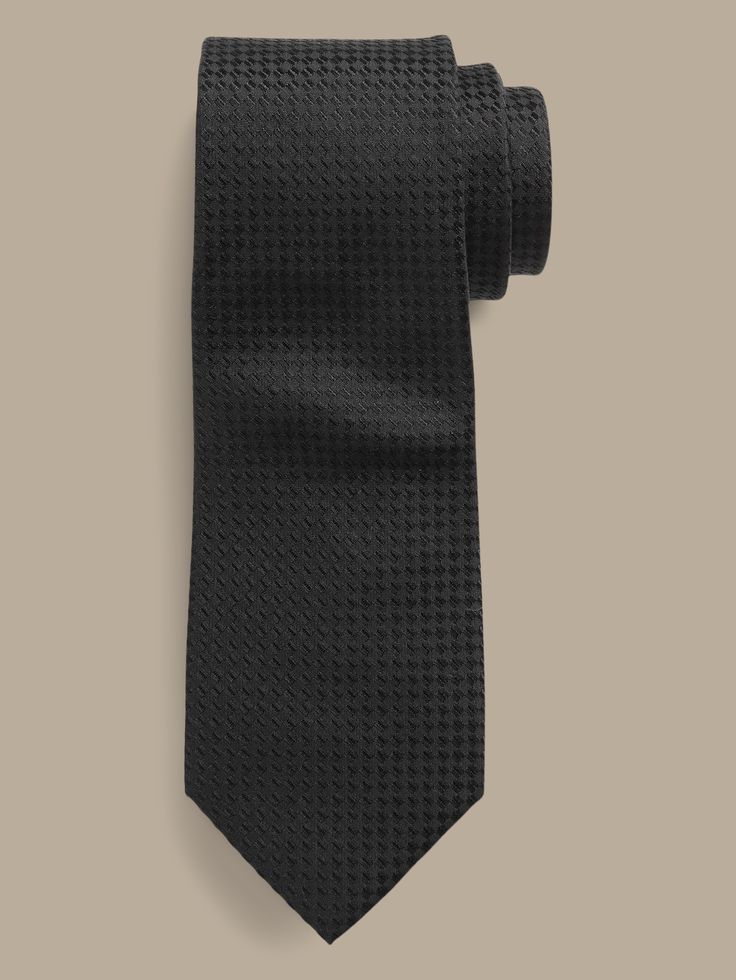 An unequivocally elevated tie, crafted from luxurious, soft silk with a varied texture.  Hand-pressed and shaped for a clean finish.  Measures 3" at widest point.  Length: 58" (147cm) Modern Standard Tie For Semi-formal Occasions, Modern Standard Tie For Semi-formal Events, Modern Standard Tie For Office, Modern Fitted Ties For Formal Occasions, Luxury Ties For Office Suit Accessories, Elegant Solid Color Neckwear For Black Tie Events, Elegant Standard Tie For Semi-formal Occasion, Elegant Solid Neckwear For Black Tie Events, Elegant Solid Neckwear For Black Tie Occasions