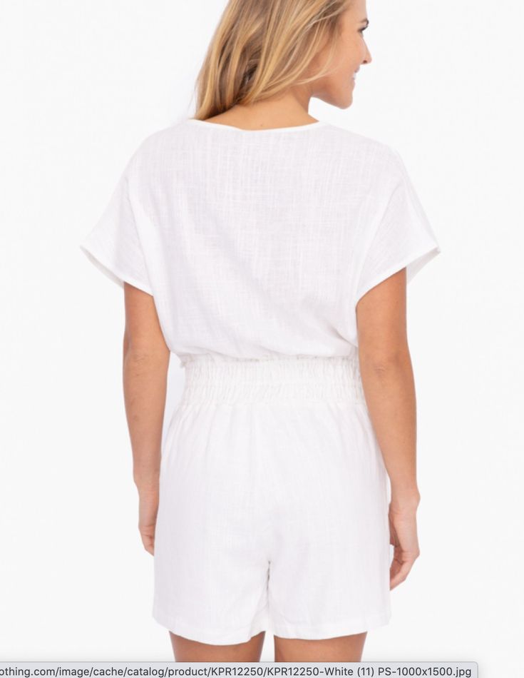 Effortlessly chic and versatile, our Dolman Sleeve Resort Romper in White is the perfect addition to your wardrobe. The dolman sleeve adds a touch of elegance, while the resort-inspired design makes it ideal for any occasion. Stay stylish and comfortable all day long with our romper, perfect for any fashion-forward individual. Material: 70% Rayon, 30% Linen White Vacation Tops With Elastic Waistband, Relaxed V-neck Blouse For Vacation, Relaxed Summer Tops With Elastic Waistband, Summer Vacation Top With Elastic Waistband, Summer Vacation Tops With Elastic Waistband, Summer Tops With Elastic Waistband For Vacation, Chic Beach Tops With Elastic Waistband, Chic Relaxed Fit Blouse For Vacation, Casual V-neck Tops With Elastic Waistband