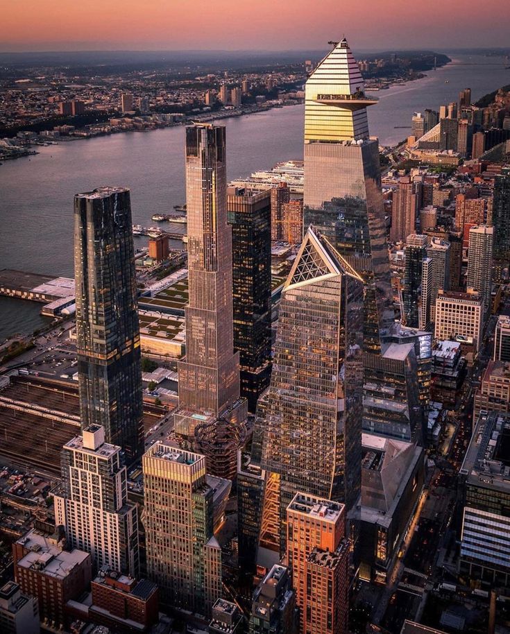 an aerial view of new york city at sunset