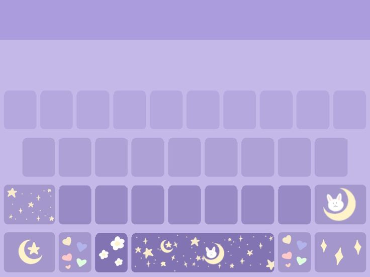 a purple keyboard with stars, moon and clouds on it