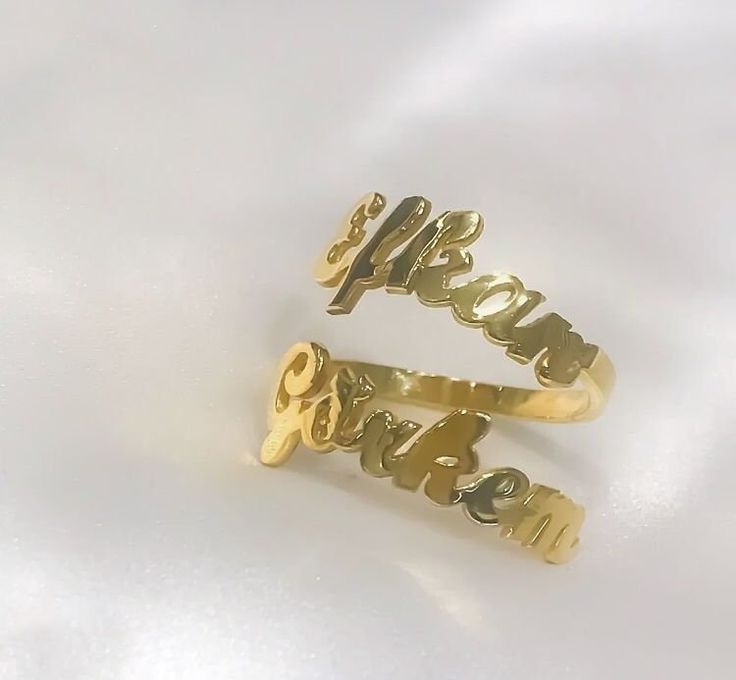 This 14K solid gold double name ring  is a  meaningful gift for your loved one or a special treat just for yourself . You can buy this personalized two name ring as an engagement ring which includes couple's names . This affordable and thoughtful custom multiple name ring gift will surely be treasured by your loved one.   *FEATURES Material : 14 K Solid Gold  Colour : gold * PACKAGING Jewels will be sent nicely wrapped and packed in a box! If specific goods are intended as gifts, please leave us a note. We'll use a special box separately and include a gift card for you! The most unique jewelry you can find, a perfect gift for you and your loved one ... Birthday Gift , Wedding Gift , Gift For Love ,  Bridesmaid Gift , Anniversary Gift , Mother's Day Gift , Graduation Gift * SHIPPING DETAILS Customized Nameplate Rings For Anniversary, Gold Promise Ring With Name, Yellow Gold Custom Name Promise Rings, Customized Gold Engraved Promise Ring, Yellow Gold Promise Rings With Custom Name, Gold Nameplate Ring For Gift, Nameplate Rings Suitable For Gifts, Nameplate Ring As Gift, Custom Name Gold Promise Ring