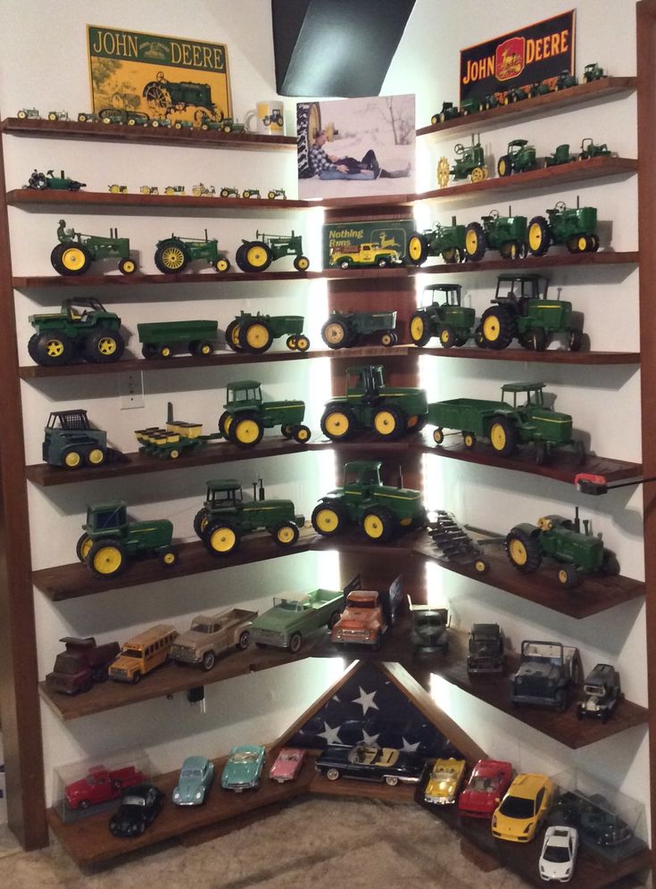 there are many toy trucks on the shelves