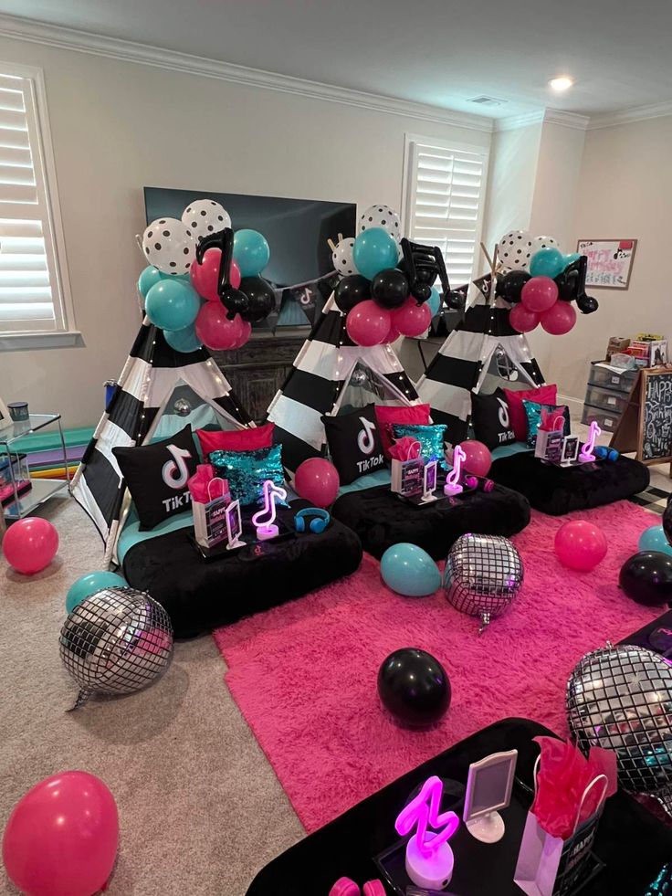 a room filled with lots of balloons and decorations