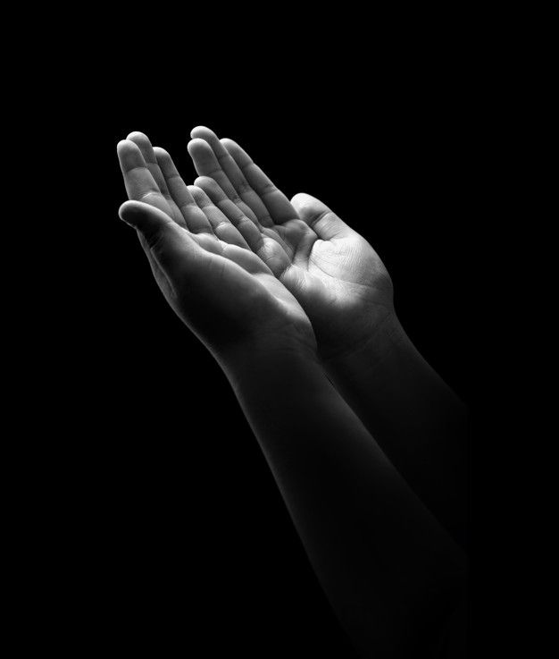 black and white photograph of two hands in the air