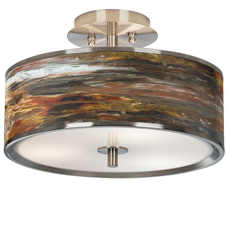 a semi flush light fixture with an abstract design