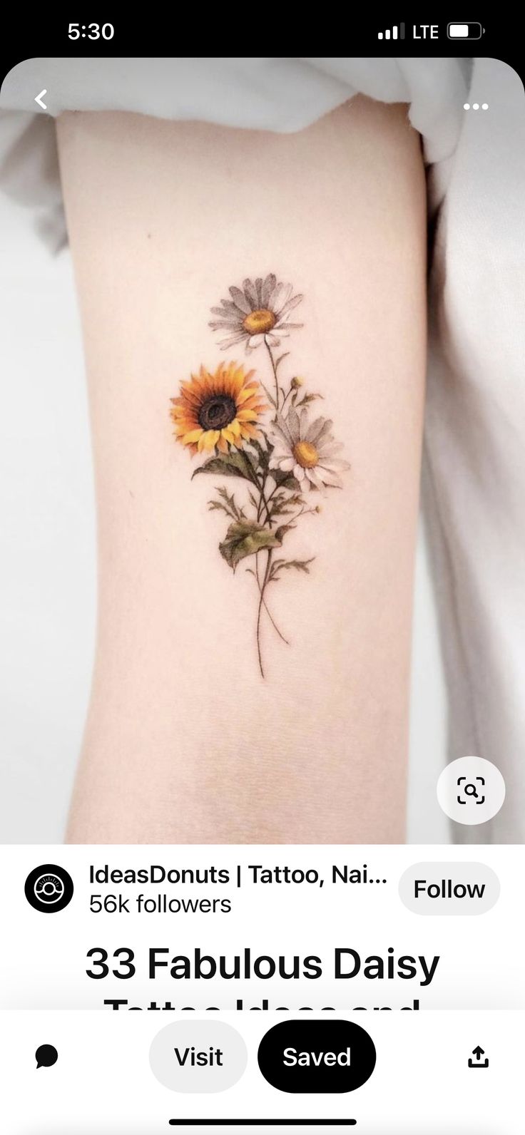 a sunflower tattoo on the back of a woman's thigh