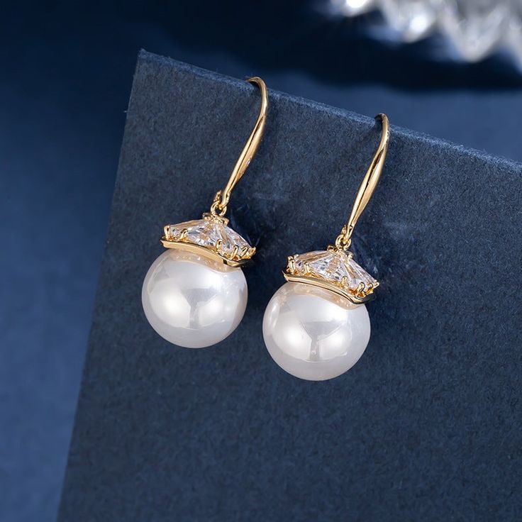 * Buy over 2 pieces and get a medium jewelry organizer* Buy over $100 and get a large mirror jewelry organizer Vintage Pearl Earrings Take a look at our beautiful pearl earring design. These pearl drop earrings have been designed by a nature-originated jewelry designer and are made with faux pearls to give you an affordable and vintage style. Made with shell pearls and silver pins, these pearl earrings are easy to care for and will take your look from casual to formal in an instant. Product Spec Big Pearl Earrings, Handmade Pearl Jewelry, Pearl Earrings Designs, Mirror Jewelry, Mother Of Pearl Jewelry, Jewelry Mirror, Big Pearl, Vintage Pearl, Pearl Earring