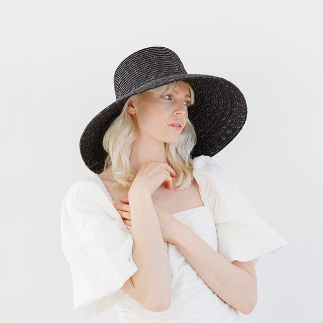 Jolie is a showstopper with an ultra-classic silhouette. Braided from all-natural wheat straw, its unique weave gives this bell-shaped hat depth + texture that continues through the sloped brim. Jolie's bold + beautiful style inspires major confidence. Elegant Woven Brimmed Straw Hat, Elegant Braided Brimmed Straw Hat, White Chic Brimmed Straw Hat, Luxury Black Brimmed Straw Hat, High-end Elegant Wide Brim Straw Hat, Straw Boater Hat, Straw Boater, Pork Pie Hat, Wheat Straw