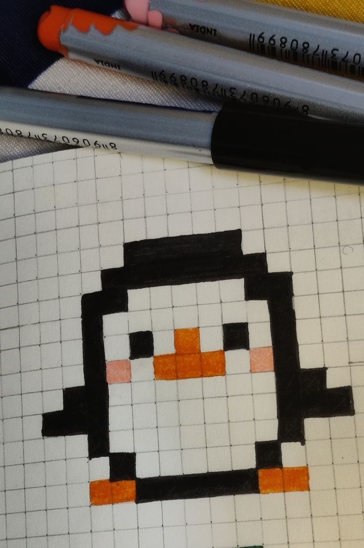 a drawing of a penguin made out of crayon pencils on top of a piece of paper