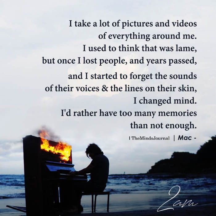 a person sitting in front of a piano on top of a beach