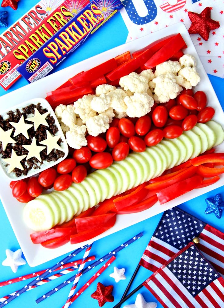 an american flag platter with red, white and blue food on it for fourth of july