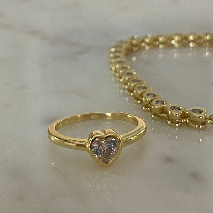 "Beautiful heart shaped Purity Ring. <3 \"Blessed are the pure in heart, for they shall see God.\" Matthew 5:8 <3 -coated with a thick plating of 14k gold or rhodium -available in sizes 4-12 All sales are Final Sale on all purity rings, so make sure you know you're corrects measurements + rings size! :)- Nickel-free & Hypoallergenic" Gold Heart Ring For Mother's Day Promise, Gold Heart Promise Ring For Mother's Day, Gold Heart Ring With Heart Charm, Gold Heart Ring With Vs Clarity For Promise, Heart Ring With Vvs Clarity For Valentine's Day Promise, Gold Heart Ring For Promise, Mother's Day, Gold Heart Ring With Vvs Clarity, Vvs Clarity Heart Ring For Valentine's Day Promise, Gold Heart Cut Halo Jewelry