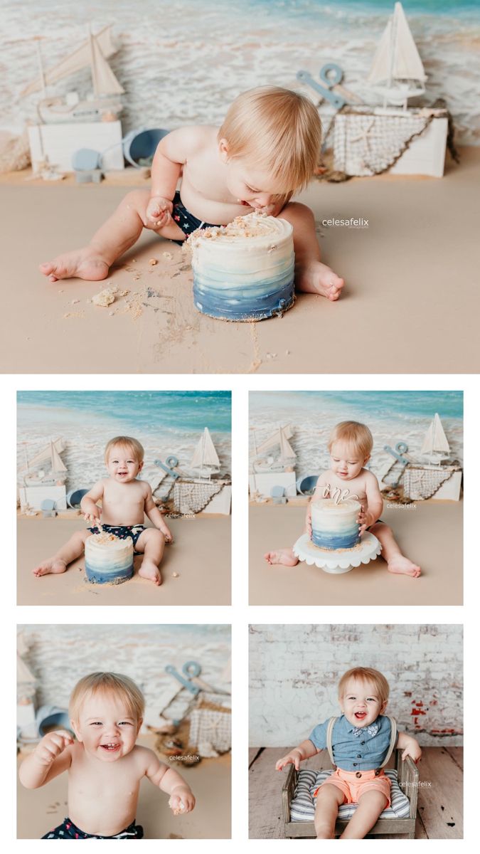 a baby sitting on the beach with a cake