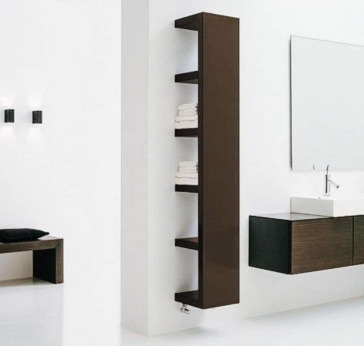 a bathroom with a sink, mirror and shelving unit