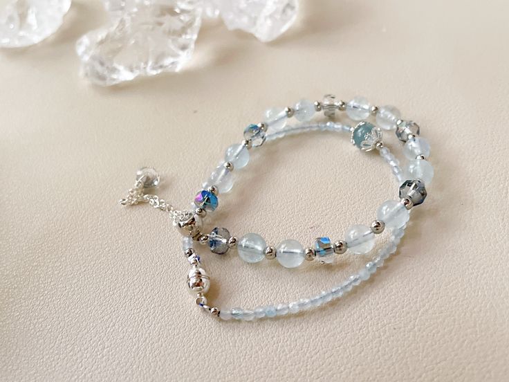 Aquamarine -stone of courage, birthstone of March -inner power strength -reduce stress and quiet the mind -promotes self-expression -sharpens the intellect and clears confusion DETAIL -2mm,6mm aquamarine stone -silver plated spacer and chain, glass beads -fits 14-16cm wrists,, model wrist size 14.5cm/5.5" Total length:  Magnetic clasp bracelet 15cm Slide clasp: 23cm Aquamarine Gemstone Beaded Bracelets For Healing, Aquamarine Beaded Bracelet As Gift, Aquamarine Beaded Bracelets As Gift, Beaded Aquamarine Bracelet For Gift, Turquoise Aquamarine Beaded Bracelets As Gift, Healing Aquamarine Gemstone Beaded Bracelets, Adjustable Aquamarine Beaded Bracelet With Natural Stones, Adjustable Aquamarine Beaded Bracelet As Gift, Adjustable Aquamarine Beaded Bracelets With Natural Stones