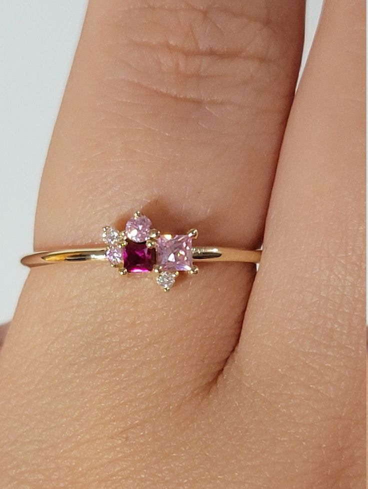 "Ruby Diamond Ring / Cluster Diamond Ring / Cluster Gemstones Ring / Personalized Birthstone Rings / Pink Sapphire Ring / Ruby Ring / Anniversary ring ♥ Features : * Made to Order. * Made in NYC. * Gold: Solid 14K( Also available in18K) *Width of band: 1.3mm * Choice of Gold: Yellow Gold, White Gold, Rose Gold, or Platinum * Gem Stone: Pink Sapphire, Ruby, Mined Diamond * Stones details: * 2PCS Round Diamonds 1.5mm each Diamond Color-Clarity: G Color SI Clarity * 1 Square Pink Sapphire: 2.5x 2.5 14k Gold Birthstone Cluster Ring, Fine Jewelry Multi-stone Diamond Promise Ring, Promise Multi-stone Diamond Ring Round Cut, Pink Diamond Cluster Ring With Multi-stone, Fine Jewelry Pink Sapphire Promise Ring, Heart Cut Multi-stone Diamond Rings, Anniversary Rings With Rose Cut Pink Sapphire, 14k Gold Cluster Ring With Birthstone, Diamond Open Ring With Birthstone