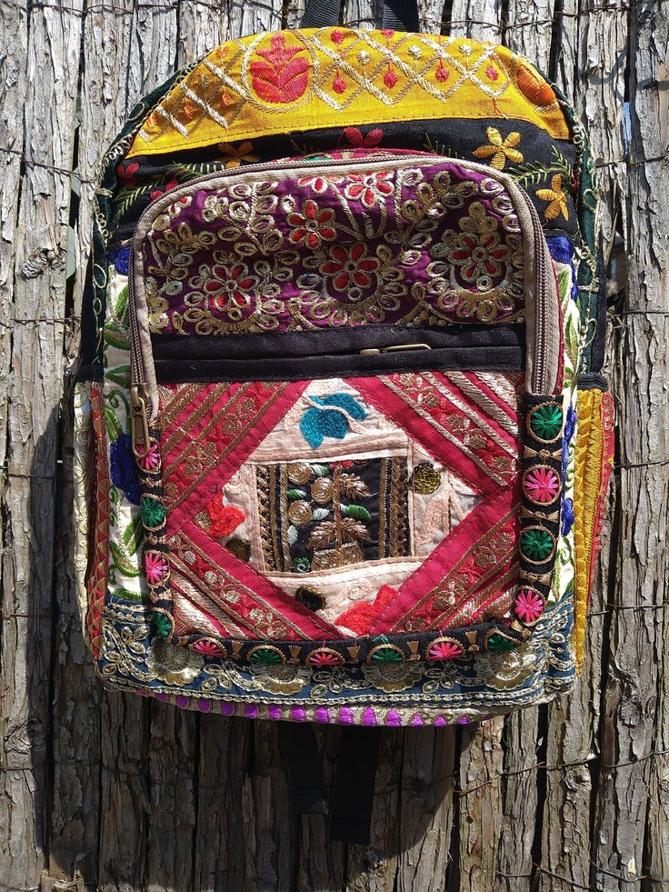 Fabulous, richly coloured fabric rucksack, boho styling with vibrant colours, reds, pinks, gold and turquoise. Gorgeous embroidered patterns. Adjustable straps, inner and outer pockets with zip fastening. Ethically sourced. Traditional Multicolor Backpack For Travel, Bohemian Backpack For Festivals, Bohemian Multicolor Backpack For Festival, Multicolor Rectangular Backpack For Festivals, Festival Rectangular Multicolor Backpack, Multicolor Rectangular Festival Backpack, Bohemian Multicolor Backpack With Adjustable Strap, Traditional Travel Backpack, Traditional Multicolor Rectangular Backpack