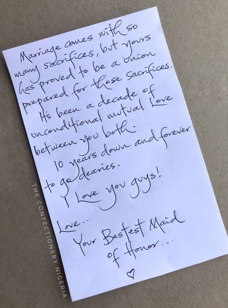 a piece of paper with writing on it and a note attached to the back of it