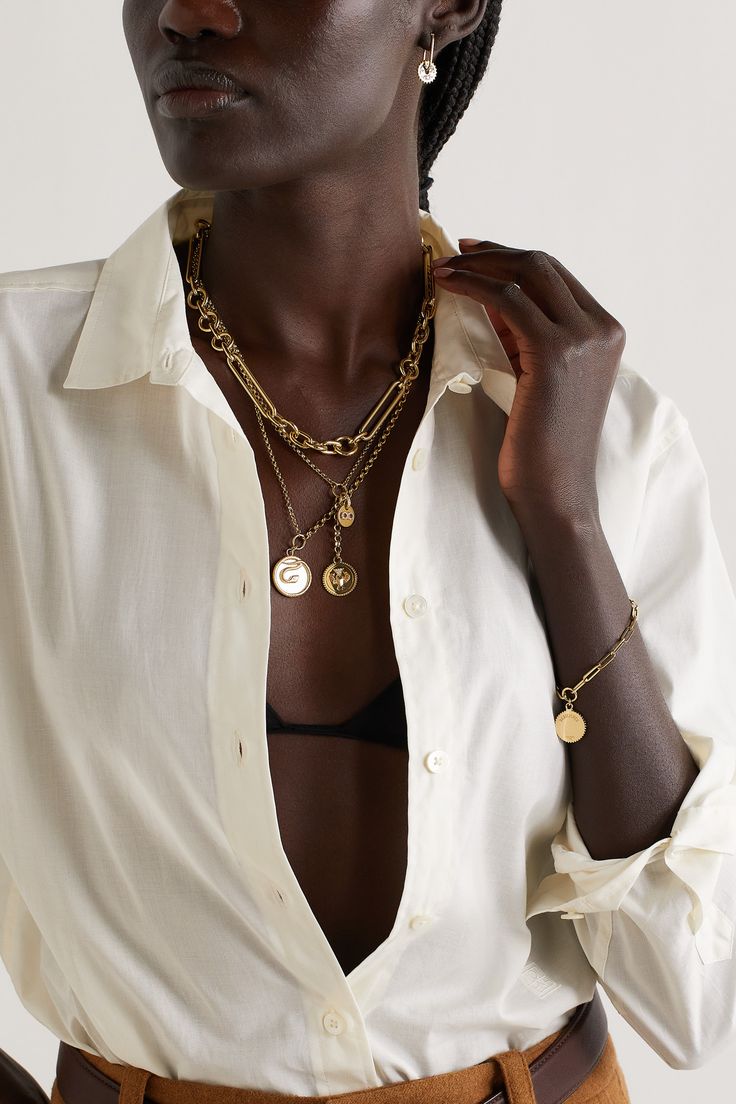 The snake on Foundrae's necklace holds so much meaning - it represents wholeness and is known as a "talisman of rejuvenation - they shed their skin to grow, just as we need continued growth to find balance." It's handmade from 18-karat gold and inlaid with glossy white enamel and a single diamond. Wear it layered with other symbolic styles from the brand. Luxury 17 Jewels Pendant Chain Necklace, Luxury Brass Jewelry With Coin Pendant, Timeless Yellow Gold Necklaces, Luxury Gold Plated Pendant Chain Necklace, Timeless Gold Plated Chain Necklace With Jewels, Luxury Yellow Gold-plated Coin Necklace, Luxury Brass Chain Jewelry, Luxury Gold Plated Tarnish Resistant Coin Necklace, Luxury Gold-plated Tarnish-resistant Coin Necklace