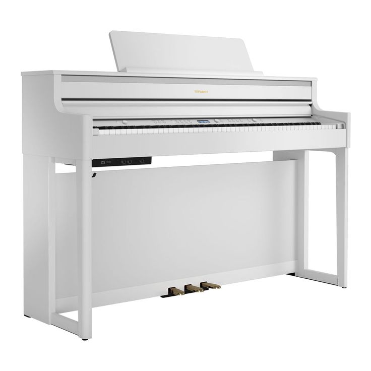 a white piano sitting on top of a table