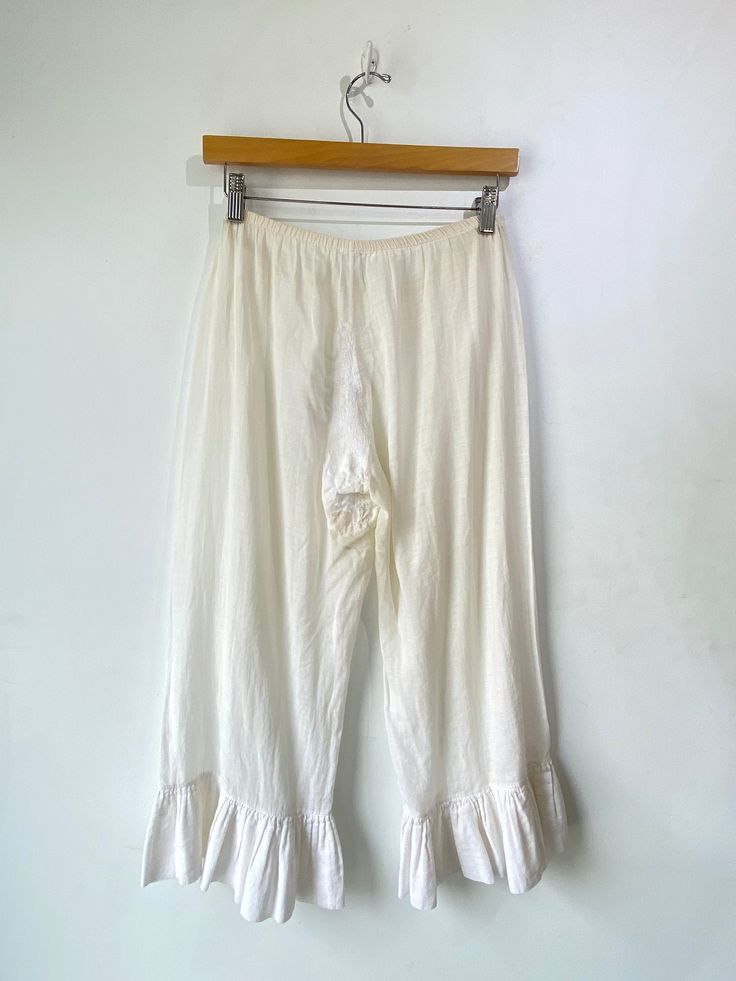 Dosa White Bloomers! These are meant to be pranced in. 100% cotton with ruffles along the hem and an elastic waistband. Hand spun in India. Marked a size 1, would best fit a medium. Signs of wear throughout, priced as is. The bum has been patched and there is some color fading. Honestly adds to the allure though. Approx. Measurements: Waist: 30-36" Rise: 10" Inseam: 21.5" White Cotton Bloomers For Beach, White Cotton Bloomers With Elastic Waistband, Long Bloomers, Spring Blue Cotton Bloomers, White Spring Bloomers, Short Length, Electric Feathers, Ryan Roche, Apiece Apart, Ace And Jig